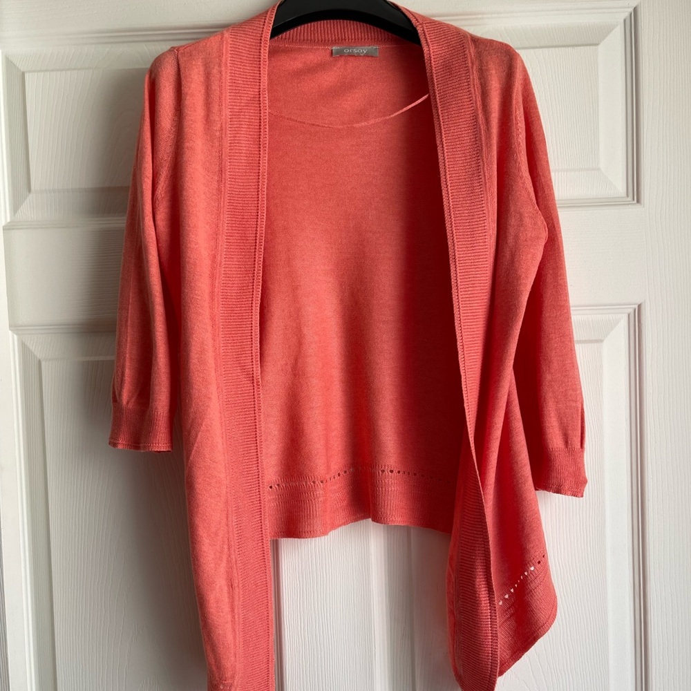 Europe brand. Light knitted cardigan. Size -S . Coral color.